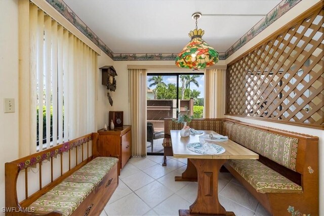 dining space with light tile patterned floors