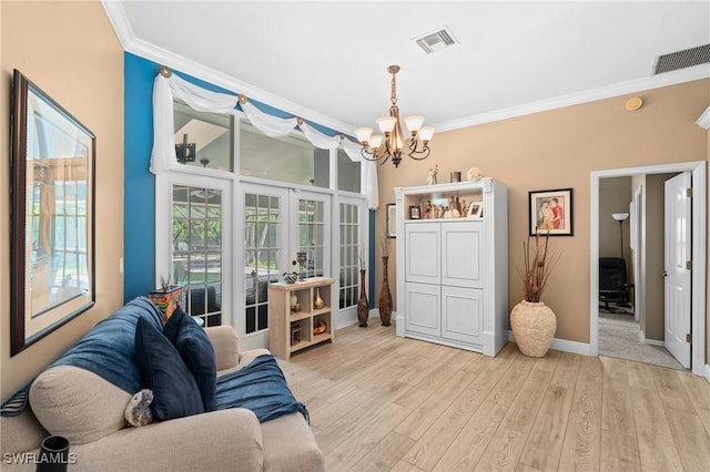 living room featuring a chandelier, crown molding, and visible vents