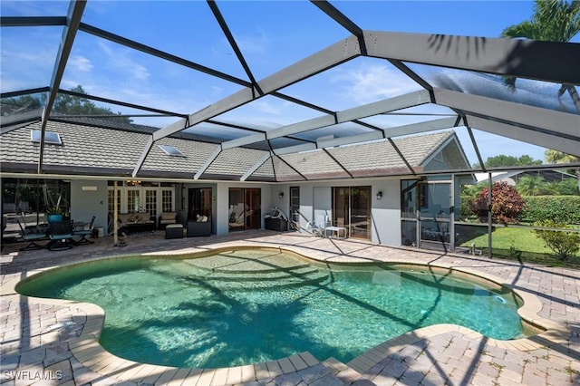 outdoor pool featuring a patio area, an outdoor living space, and a lanai