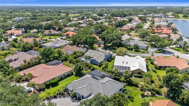 bird's eye view with a water view and a residential view