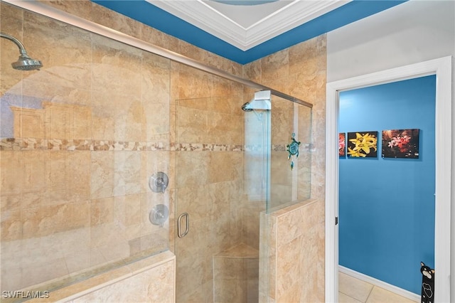 full bathroom with a shower stall, crown molding, and tile patterned flooring