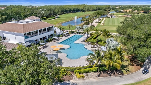 bird's eye view with a water view and view of golf course