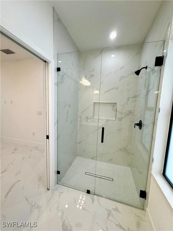 full bath featuring visible vents, marble finish floor, and a marble finish shower