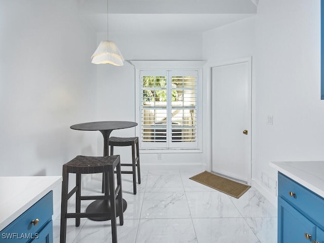 114 Amblewood Ln Unit 9-903, Naples, FL 34105 - dining space featuring light marble finish floors