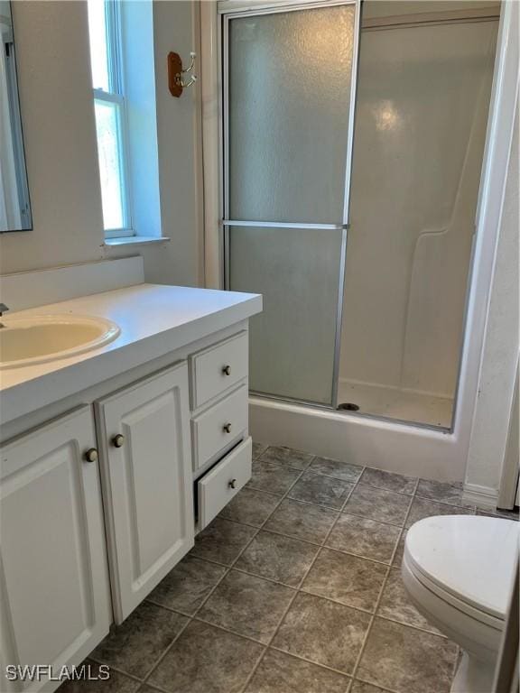 901 Thatcher Blvd, Moore Haven, FL 33471 - bathroom with vanity, a stall shower, and toilet