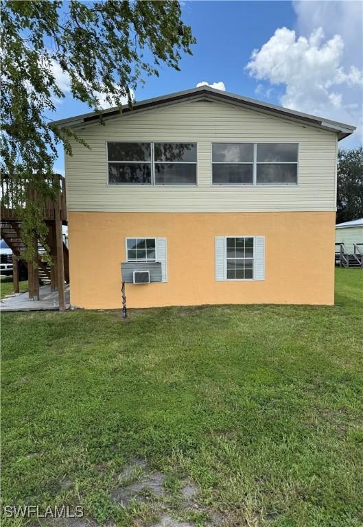 901 Thatcher Blvd, Moore Haven, FL 33471 - view of side of property featuring a yard and stucco siding