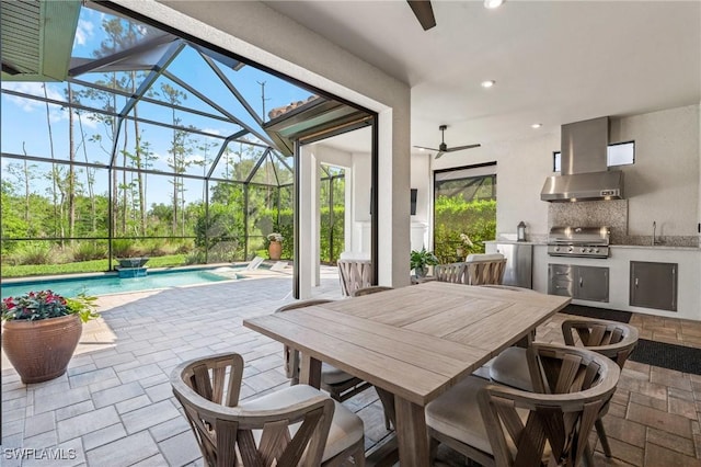 view of patio with ceiling fan, a grill, exterior kitchen, an outdoor pool, and a lanai