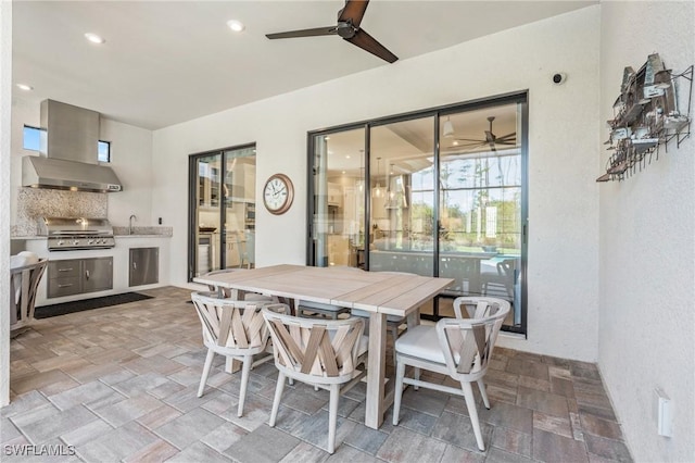 dining room featuring ceiling fan, stone finish flooring, and recessed lighting