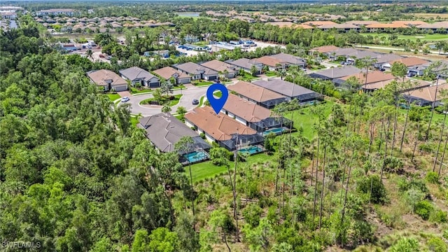 birds eye view of property with a residential view