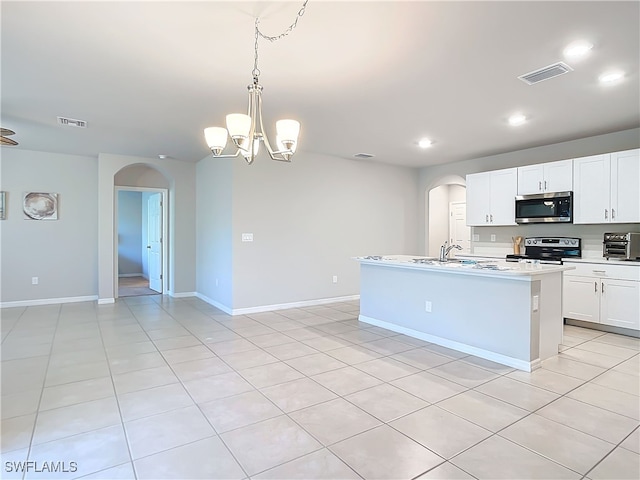 24692 Rio Villa Lakes Cir, Punta Gorda, FL 33950 - kitchen with arched walkways, visible vents, and appliances with stainless steel finishes