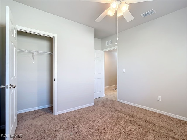 24692 Rio Villa Lakes Cir, Punta Gorda, FL 33950 - unfurnished bedroom featuring light carpet, visible vents, a closet, and baseboards