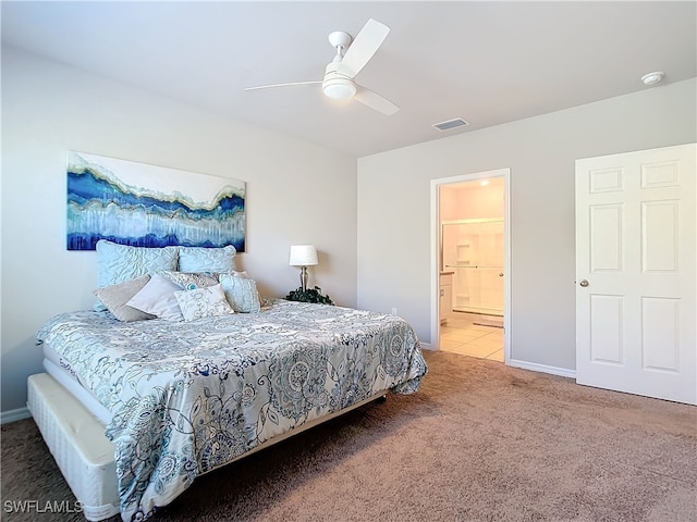 24692 Rio Villa Lakes Cir, Punta Gorda, FL 33950 - carpeted bedroom featuring baseboards, a ceiling fan, visible vents, and connected bathroom