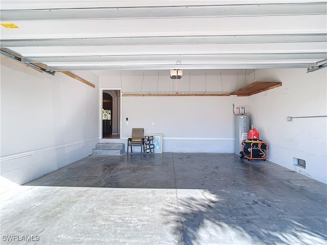 24692 Rio Villa Lakes Cir, Punta Gorda, FL 33950 - garage with water heater and a garage door opener