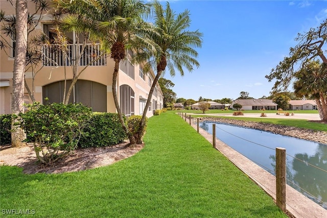 1090 Woodshire Ln Unit F206, Naples, FL 34105 - view of grassy yard with a balcony