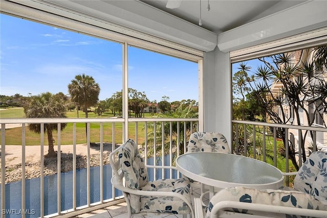 1090 Woodshire Ln Unit F206, Naples, FL 34105 - sunroom featuring a ceiling fan