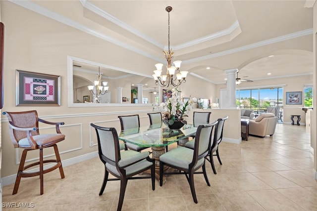 3536 Cherry Blossom Ct Unit 201, Estero, FL 33928 - dining room featuring decorative columns, arched walkways, a chandelier, light tile patterned floors, and a tray ceiling