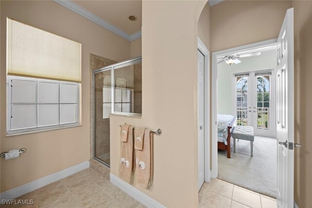 3536 Cherry Blossom Ct Unit 201, Estero, FL 33928 - ensuite bathroom with ornamental molding, french doors, a shower stall, and tile patterned floors