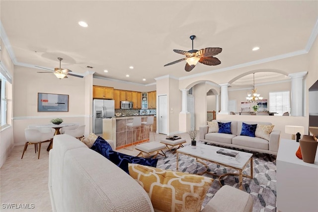 3536 Cherry Blossom Ct Unit 201, Estero, FL 33928 - living room with ornate columns, ceiling fan, arched walkways, recessed lighting, and crown molding