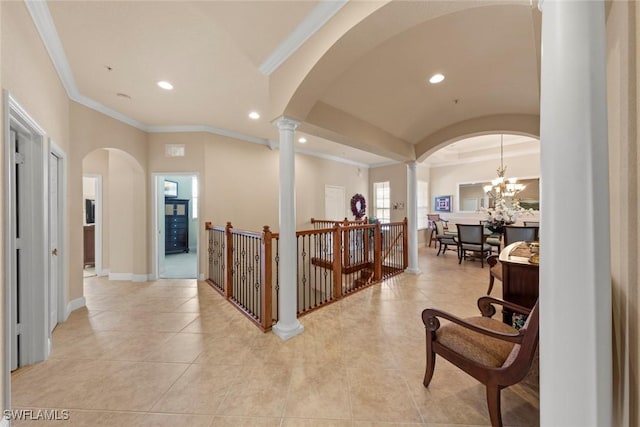 3536 Cherry Blossom Ct Unit 201, Estero, FL 33928 - corridor with decorative columns, crown molding, arched walkways, recessed lighting, and light tile patterned floors