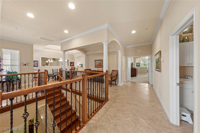 3536 Cherry Blossom Ct Unit 201, Estero, FL 33928 - hallway featuring ornate columns, light tile patterned floors, an upstairs landing, recessed lighting, and crown molding