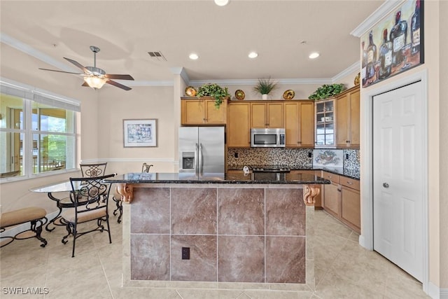 3536 Cherry Blossom Ct Unit 201, Estero, FL 33928 - kitchen with stainless steel appliances, ornamental molding, light tile patterned flooring, dark stone counters, and ceiling fan