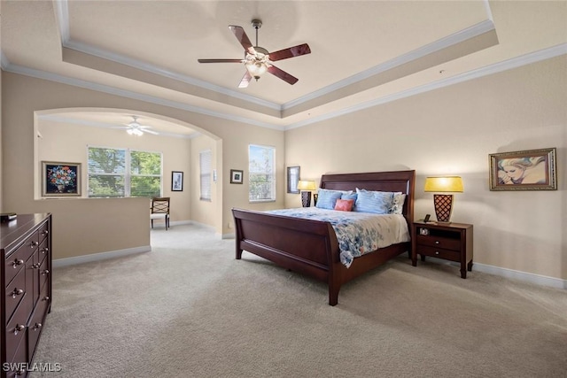 3536 Cherry Blossom Ct Unit 201, Estero, FL 33928 - bedroom with a raised ceiling, ornamental molding, light carpet, arched walkways, and a ceiling fan