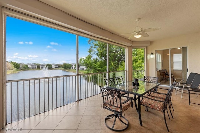 3536 Cherry Blossom Ct Unit 201, Estero, FL 33928 - sunroom featuring a water view, a textured ceiling, and tile patterned flooring