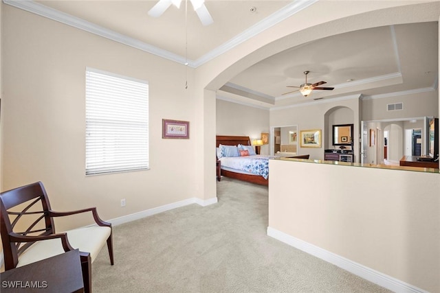 3536 Cherry Blossom Ct Unit 201, Estero, FL 33928 - carpeted bedroom with arched walkways, a tray ceiling, and crown molding