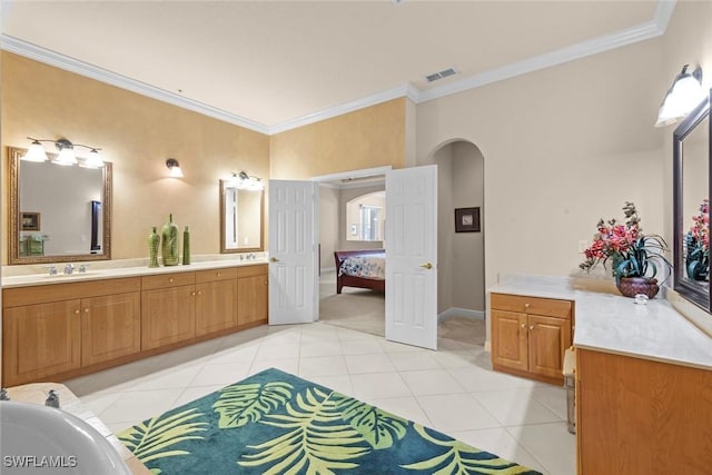 3536 Cherry Blossom Ct Unit 201, Estero, FL 33928 - ensuite bathroom featuring crown molding, tile patterned flooring, double vanity, and a bath