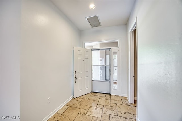 5482 Peppertree Dr, Fort Myers, FL 33908 - entryway with stone tile floors, baseboards, and visible vents