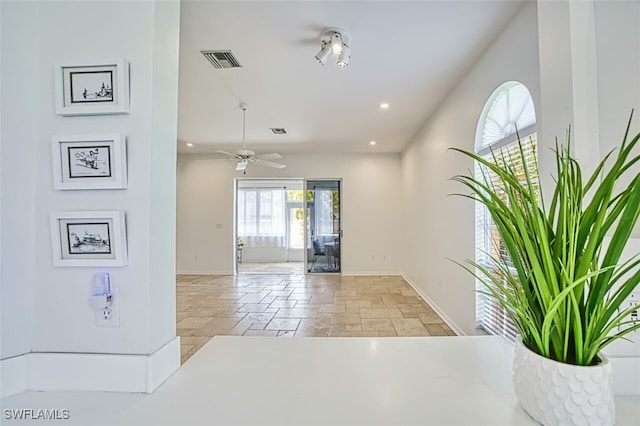 5482 Peppertree Dr, Fort Myers, FL 33908 - hallway featuring visible vents, baseboards, and stone tile floors