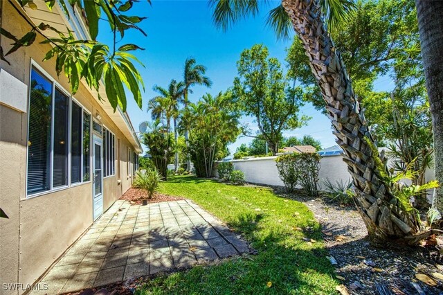 5482 Peppertree Dr, Fort Myers, FL 33908 - view of yard with a patio area