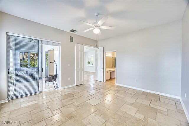 5482 Peppertree Dr, Fort Myers, FL 33908 - unfurnished room with visible vents, stone tile floors, baseboards, and ceiling fan