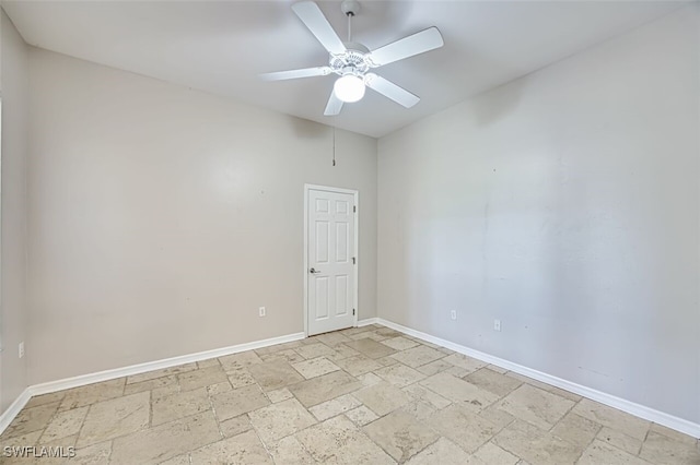 5482 Peppertree Dr, Fort Myers, FL 33908 - empty room featuring baseboards, a ceiling fan, and stone tile flooring