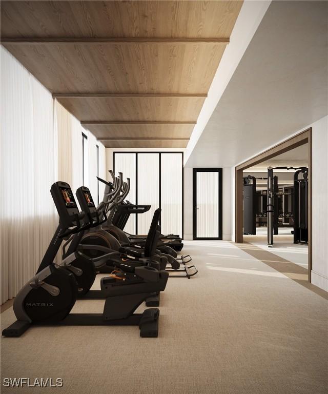 936 5th Ave S Unit 202, Naples, FL 34102 - exercise room with wood ceiling and carpet
