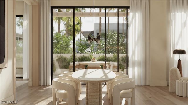 936 5th Ave S Unit 202, Naples, FL 34102 - dining room featuring light wood-style flooring