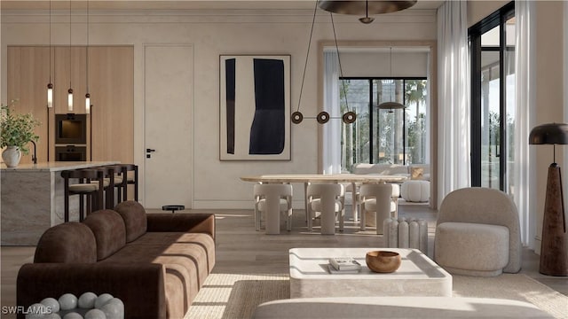 936 5th Ave S Unit 202, Naples, FL 34102 - living room featuring ornamental molding and wood finished floors