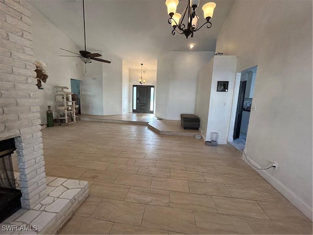 8860 Banyan Cove Cir S Unit 0, Fort Myers, FL 33919 - unfurnished living room with high vaulted ceiling, a chandelier, a ceiling fan, and baseboards