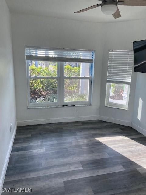 8860 Banyan Cove Cir S Unit 0, Fort Myers, FL 33919 - unfurnished room featuring baseboards, a ceiling fan, and wood finished floors