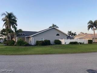 8860 Banyan Cove Cir S Unit 0, Fort Myers, FL 33919 - view of home's exterior with a lawn