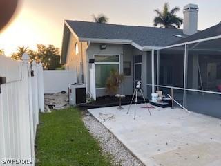 8860 Banyan Cove Cir S Unit 0, Fort Myers, FL 33919 - back of house with a patio area and a lanai