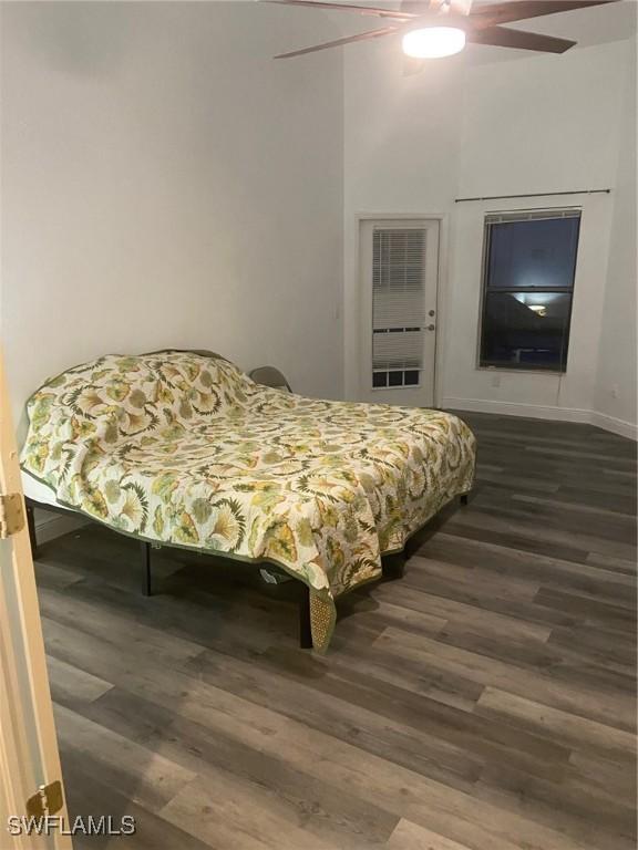 8860 Banyan Cove Cir S Unit 0, Fort Myers, FL 33919 - bedroom with dark wood-type flooring, ceiling fan, and baseboards