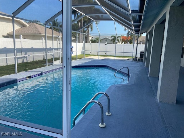 8860 Banyan Cove Cir S Unit 0, Fort Myers, FL 33919 - view of pool featuring a fenced backyard, a patio, and glass enclosure