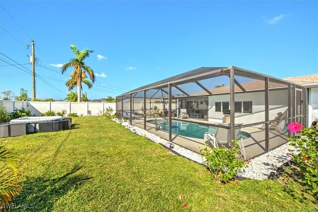 138 SE 18th Ter, Cape Coral, FL 33990 - view of pool with a fenced in pool, a fenced backyard, a lawn, and a patio area