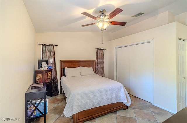 bedroom featuring light tile patterned flooring, visible vents, and ceiling fan