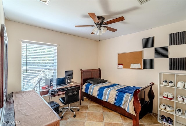 bedroom with tile patterned flooring and ceiling fan
