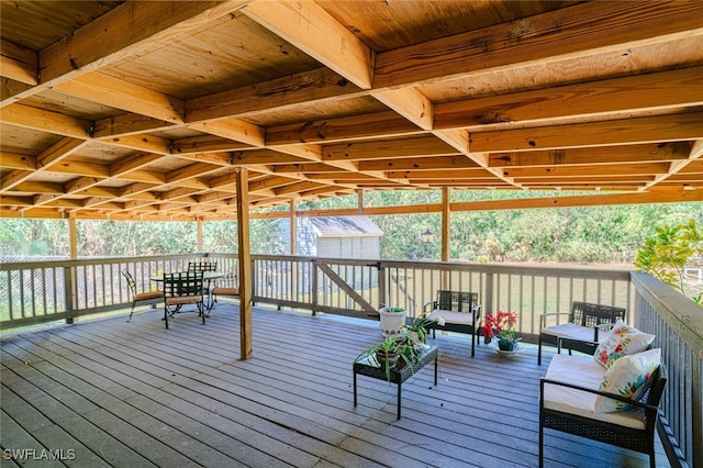 deck featuring an outbuilding and a storage shed