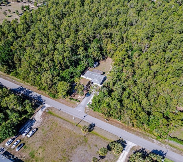 drone / aerial view with a view of trees