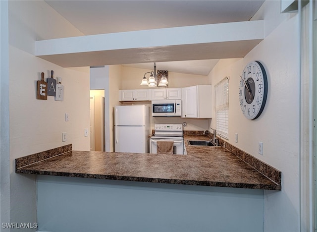 kitchen with dark countertops, a sink, white appliances, a peninsula, and a notable chandelier