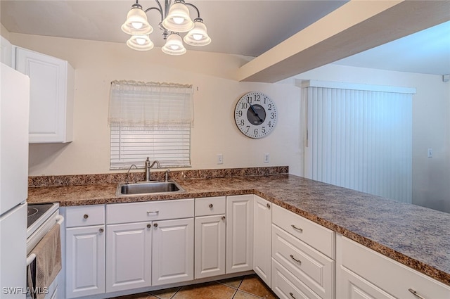 kitchen with white cabinets, white appliances, a sink, and a chandelier